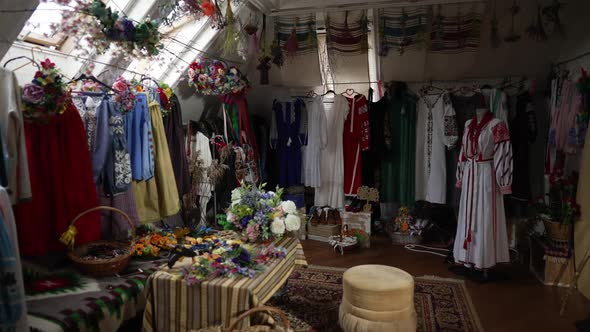 Wide Shot Room with Traditional Ukrainian Embroidered Dresses and Flowers