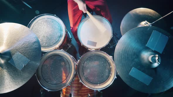 Cymbals and Drums Are Getting Hit in a View From Above