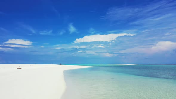 Wide angle birds eye copy space shot of a sandy white paradise beach and turquoise sea background in