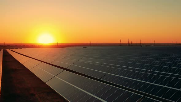 Aerial Drone View of Solar Panels at Sundown