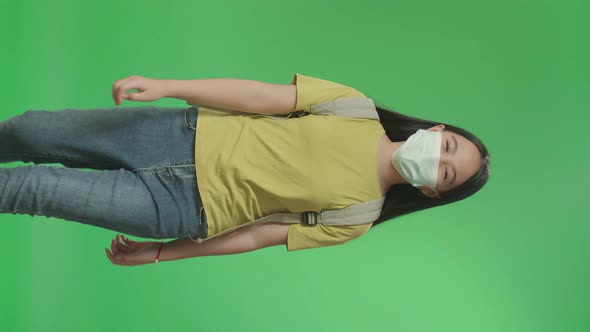 Asian Girl Student Wearing Mask And Walking To School On Green Screen Chroma Key