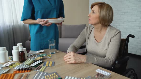 Unhappy Old Lady Moving Away Piece of Pie on the Table, Nursing Service at Home