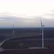 Wind Turbine Field Reveal in Aerial Dolly Out Backwards Fly View - VideoHive Item for Sale