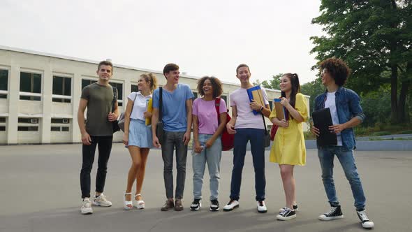 Students Laughing on Campus Near College