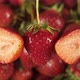 Juicy Berries Fruits On A Background Of Rotating Strawberries. - VideoHive Item for Sale