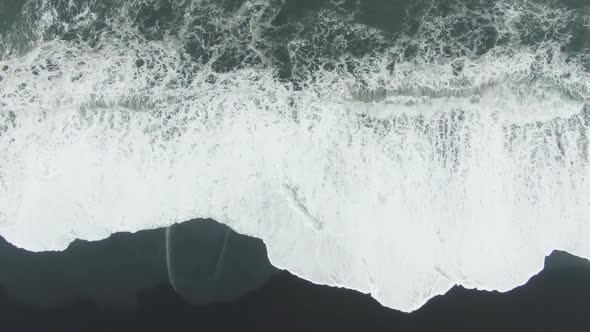 Ocean Crashing Waves. Reynisfjara Black Beach, Iceland. Aerial Top-Down View