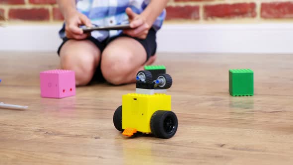 Closeup Radiocontrolled Robot Moves on Floor Little Geniuses Children Play Electronic Robots Cars