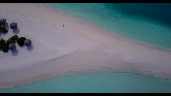 Aerial top view scenery of luxury lagoon beach break by blue ocean and white sandy background of a d