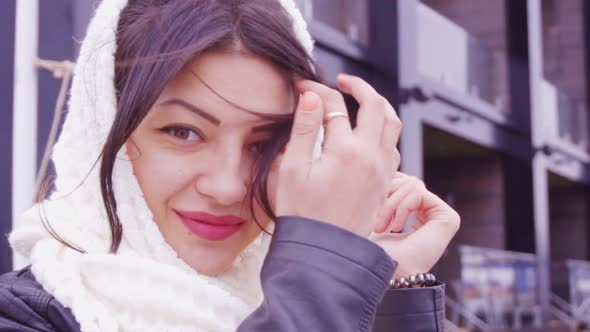 Portrait of Young Brunette Woman Looking to Camera