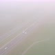 Overhead View of Cars Driving on a Highway Next to a Railroad on a Misty Day During Summer in - VideoHive Item for Sale