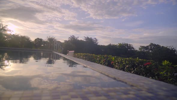 Beautiful view of a swimming pool in natural environment at sunset in Boca, Chica, Panama. Right to