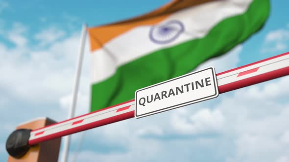 Barrier with QUARANTINE Sign Opens at Flag of India