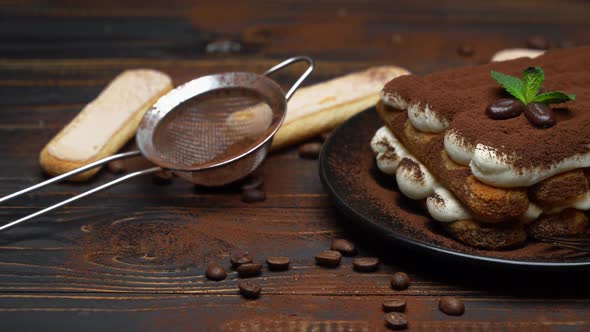 Classic Tiramisu Dessert on Ceramic Plate on Wooden Background