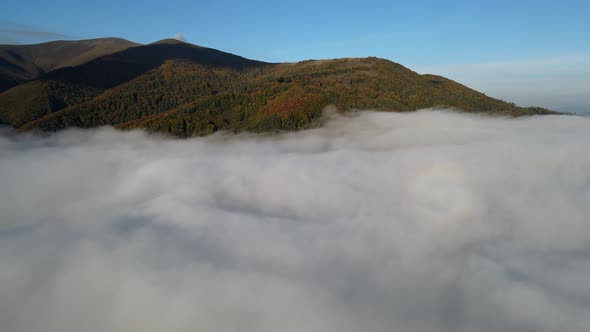 Aerial View of Autumn Carpathian Mountains Above the Clouds