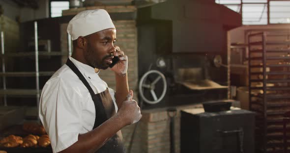 Animation of african american male baker having call