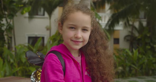 Cute Kid Child with Pretty Face on Street