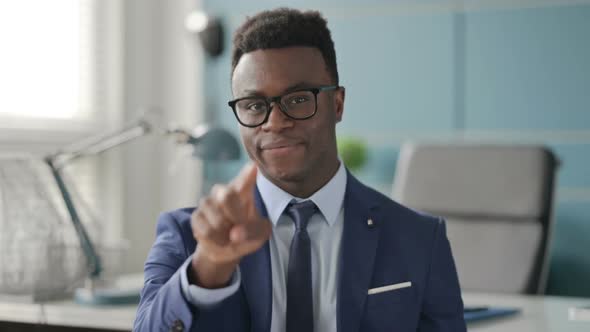 Portrait of African Businessman Pointing at the Camera