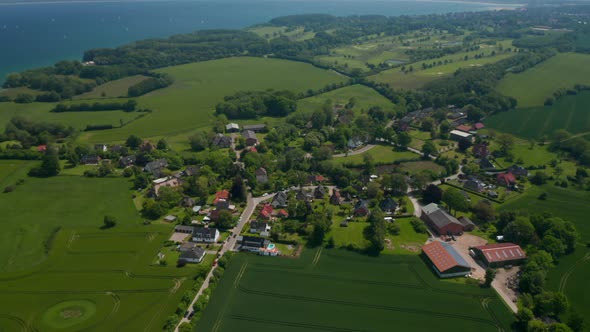 High Aerial View Circling Around Small Suburbs Residential Area in Brodten Germany Day