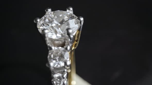 Extreme Detailed of Diamond Ring Close Up Shot While Rotating on Dark Background