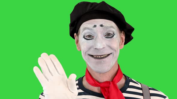 Friendly Mime Showing Hello with His Hand on a Green Screen Chroma Key