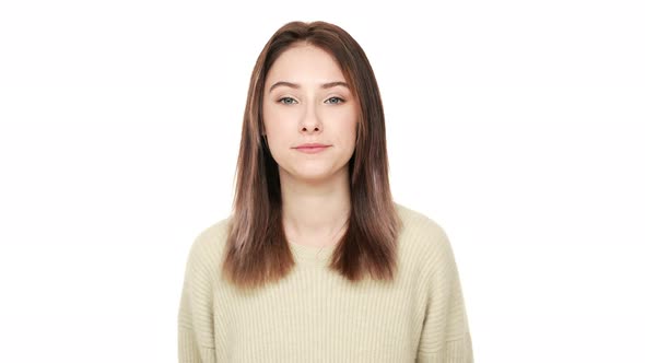 Portrait of Brunette Lady with Narrow Eyes Having Good Mood Being Positive and Smiling Over White