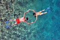 Aerial Top Down View of Couple Snorkeling in the Sea - PhotoDune Item for Sale