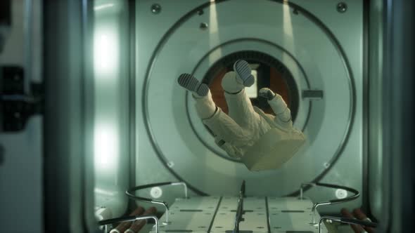 Astronaut Inside the Orbital Space Station alt