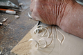 Hand of an Old Craftsman Carving a Bas-Relief in Wood - PhotoDune Item for Sale