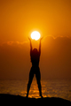 Woman Silhouette with Sun Disk in Hands. Religion and Spirituality Concept.  - PhotoDune Item for Sale