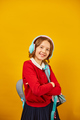 Happy schoolgirl with backpack, headphone having fun - PhotoDune Item for Sale