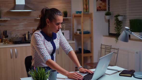 Freelance Woman Stretching Arms While Working