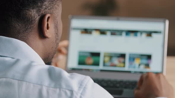 Over Shoulder View of Male Unrecognizable African Man American Young Web Designer Programmer