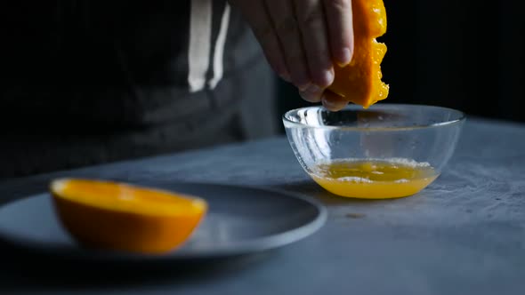 Woman Squeezing Fresh Orange Juice