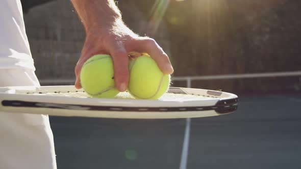 Man playing tennis on a sunny day