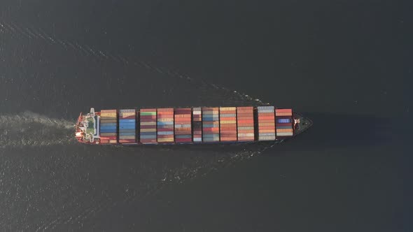 Drone View Vertically Downward on the Movement of the Container Ship at Sea