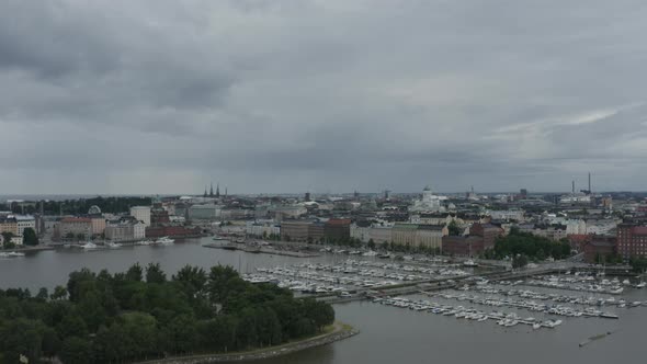 Drone view above port with many docked yachts and boats in Helsinki Finland.