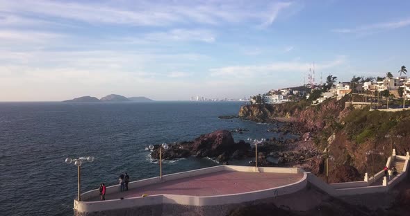 Tourists enjoying scenic lookout of amazing Mexican shore. Holiday travel destination Mazatlan - dro