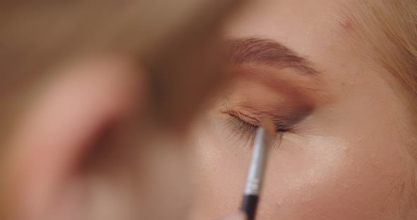 Make Up Artist Paints Eyes For A Girl