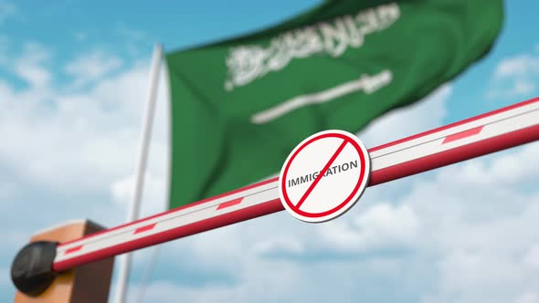 Open Gate with No Immigration Sign at the Flaf of Saudi Arabia