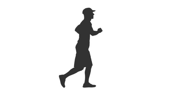 Silhouette of Man Jogging in Shorts and Cap