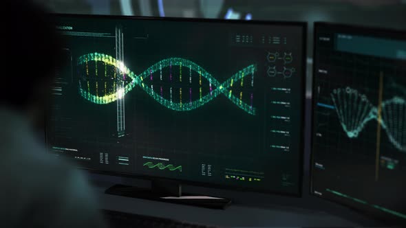 Doctor is supervising the virus software analyzing the Patient`s DNA at the lab alt