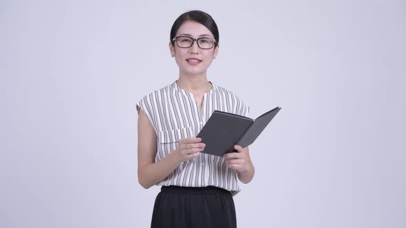 Happy Beautiful Asian Businesswoman As Teacher Reading Book