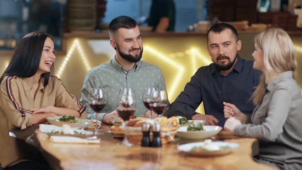 Funny Casual People Having Dinner Together Enjoying Friendship