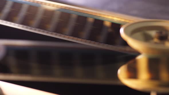 Vintage 35Mm Film Running Through a Cinema Projector in a Movie Theater