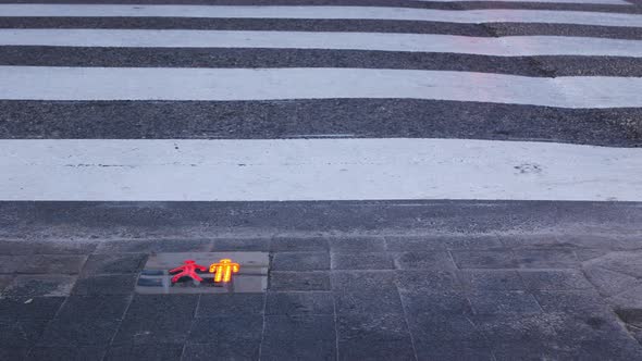 New and modern traffic light signals for pedestrians on the ground before the crosswalk