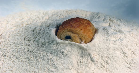 Chocolate Croissant Falling in Flour, Slow Motion 4K