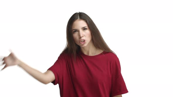 Annoyed and Angry Brunette Woman in Red Tshirt Scolding Someone Looking Pissedoff and Complaining