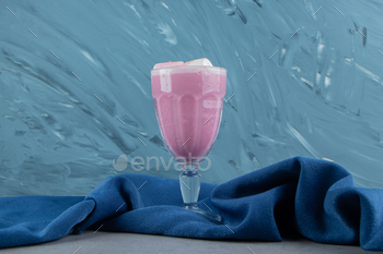 Strawberry milk shake on the towel on the marble background
