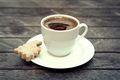Top view on small cap of strong coffee espresso with cookie on wooden table. - PhotoDune Item for Sale