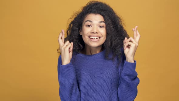 Afro American Woman Showing Cross Fingers Sign